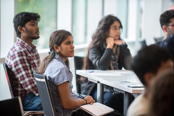 students listening to training